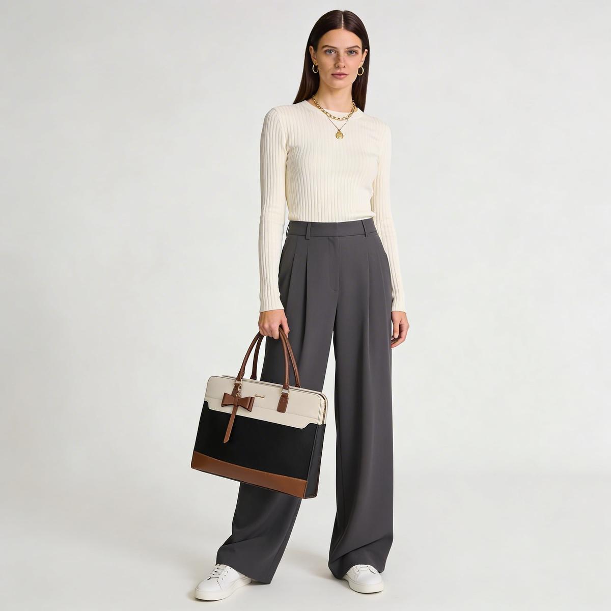 Luxury handbag on marble surface with soft lighting